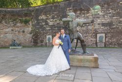 nottingham city urban wedding photography bride groom with robin hood statue outside nottingham castle